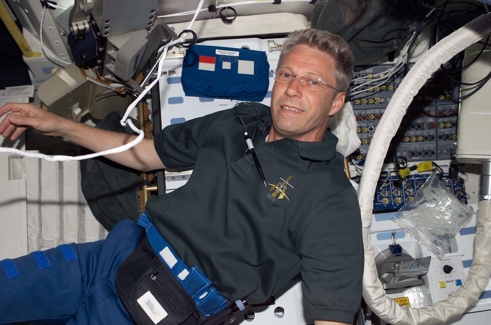 Reiter smiles at camera in the MDK during STS-121