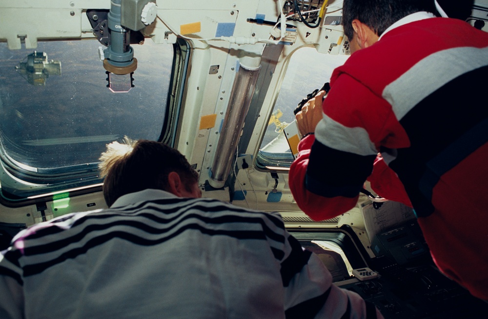 STS-51 crewmembers engage in activities in the flight deck