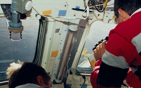 STS-51 crewmembers engage in activities in the flight deck