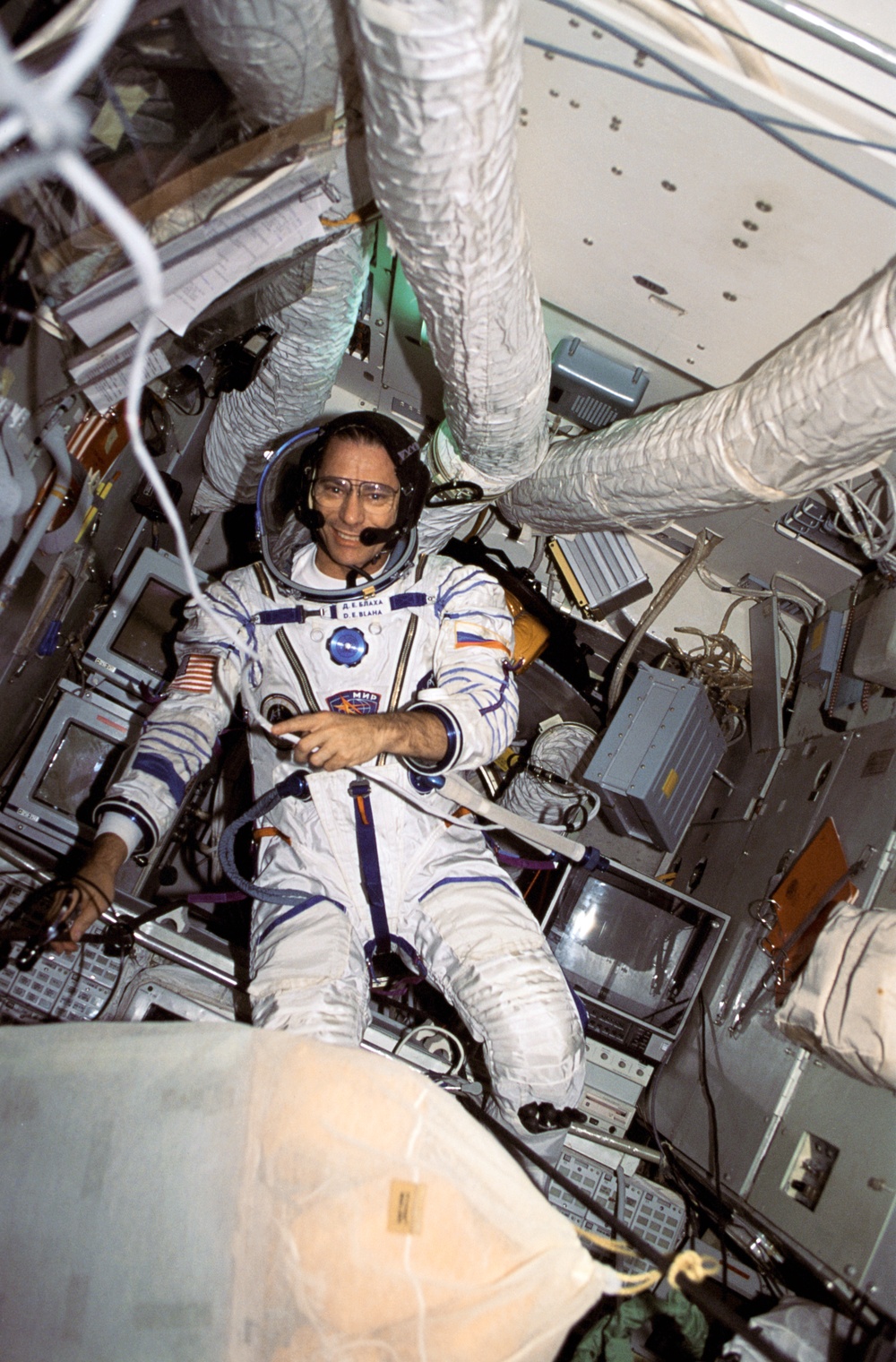 Astronaut Blaha tries on his Russian launch and entry suit