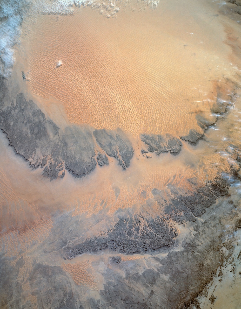 During STS-54 IUS/TDRS is released from cradle/tilt table above OV-105's PLB