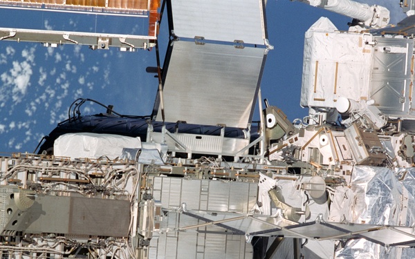 Exterior view of ISS during flyaround by STS-105 showing P6 and Z1 trusses