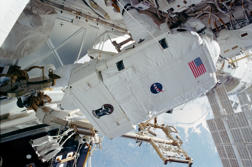 MS Tani secures Circuit Interrupt Devices on the Z1 Truss during STS-108's EVA