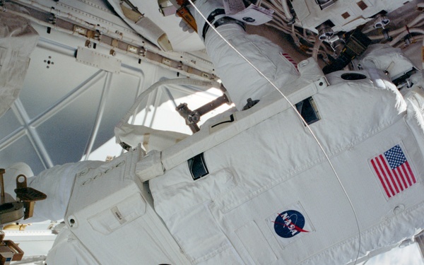 MS Tani secures Circuit Interrupt Devices on the Z1 Truss during STS-108's EVA