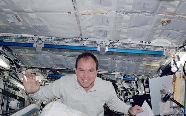 Bloomfield moves a CWC in Destiny during STS-110's visit to the ISS