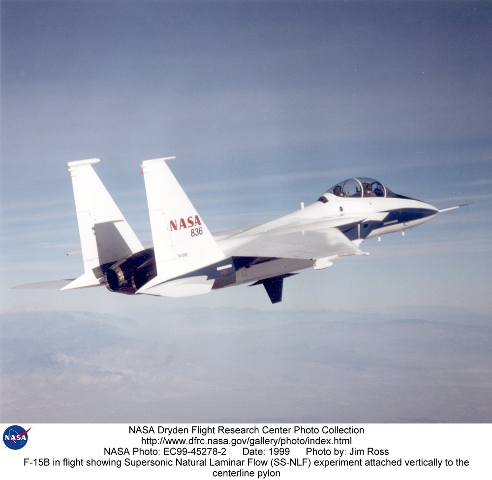 F-15B in flight showing Supersonic Natural Laminar Flow (SS-NLF) experiment attached vertically to t