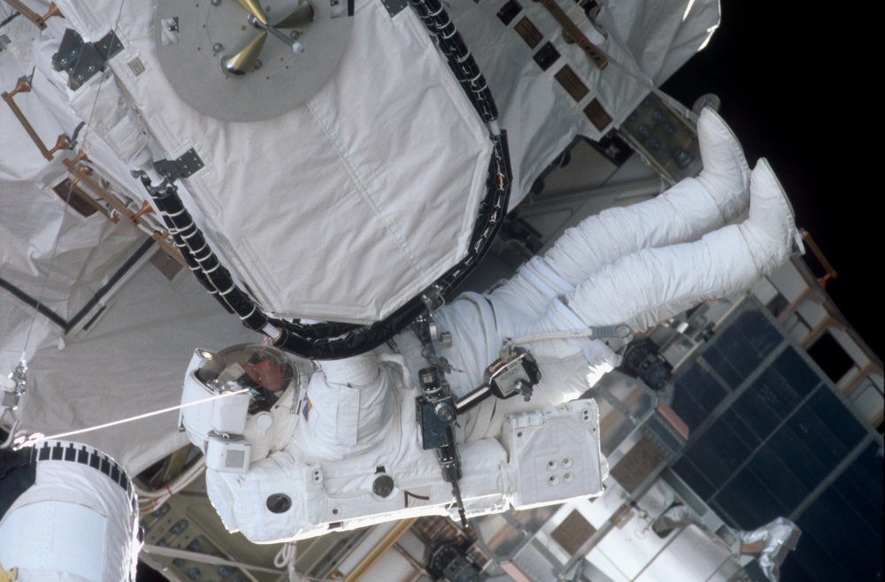 Forrester working with the EAS on the P6 Truss during EVA