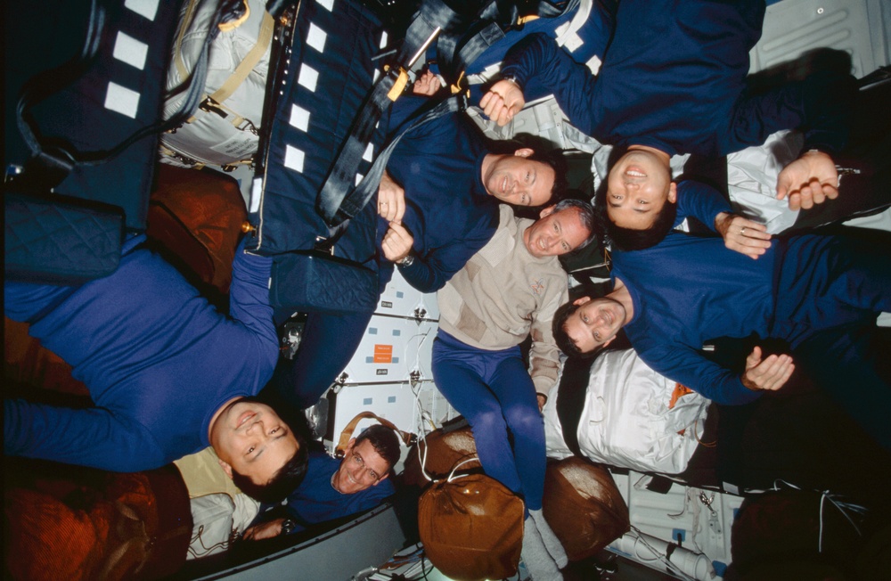 Crewmembers hang out in the middeck