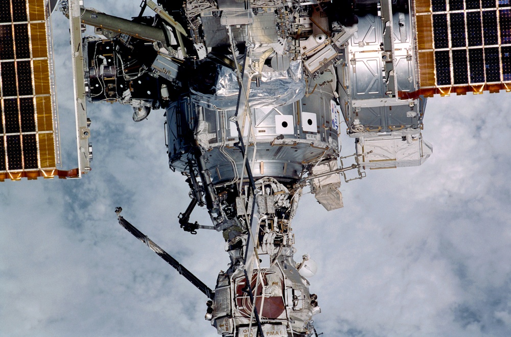 Exterior view of ISS during flyaround by STS-105 showing Node 1 and PMA1