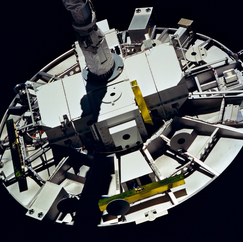 WSF, closeup of satellite grappled by RMS end effector