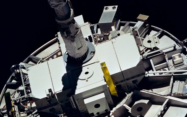 WSF, closeup of satellite grappled by RMS end effector