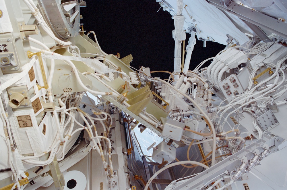 View of the aft avionics tray between the Z1 and S0 Trusses taken during the fourth EVA of STS-110