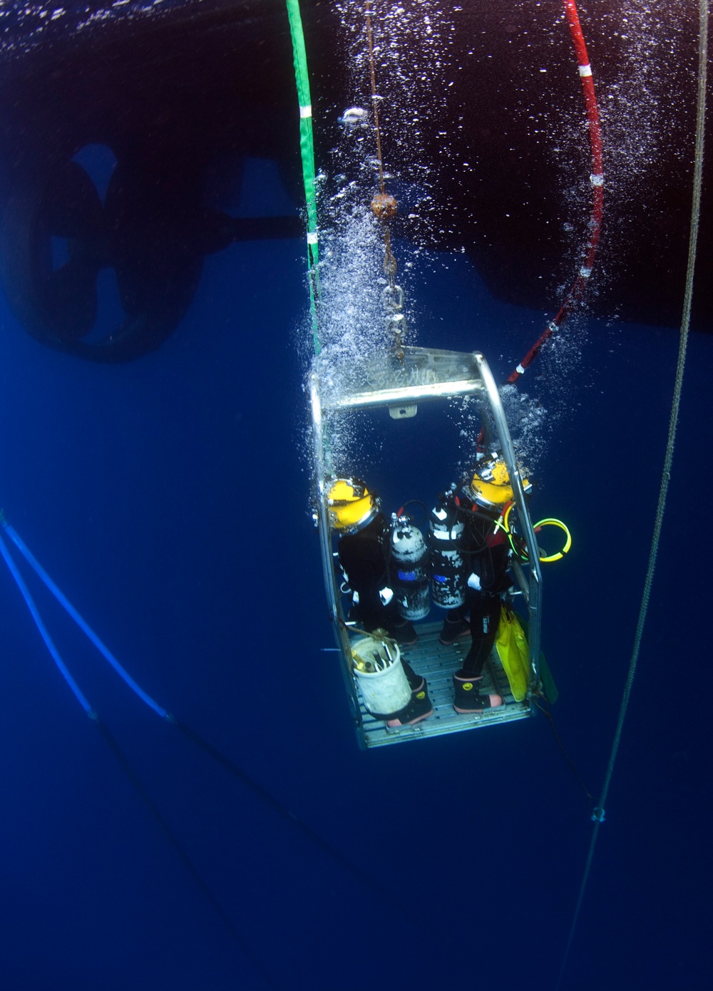 US Navy Divers, alongside the Joint POW/MIA Accounting Command, search for an unaccounted-for service member who went missing during World War II