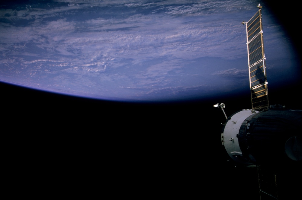 View of Soyuz with Earth view in the background taken during Expedition Six