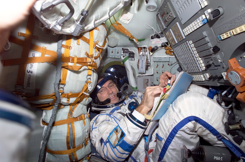 Walz seated in the Soyuz 3 capsule during Expedition Four rescue craft relocation