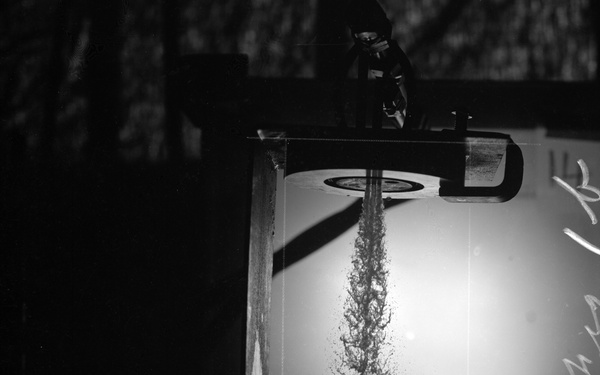 COMBUSTION AND PERFORMANCE STUDIES OF INJECTION PROCESSES IN A 200 POUND THRUST ROCKET ENGINE LIQUID OXYGEN LOX HEPTANE SYSTEM