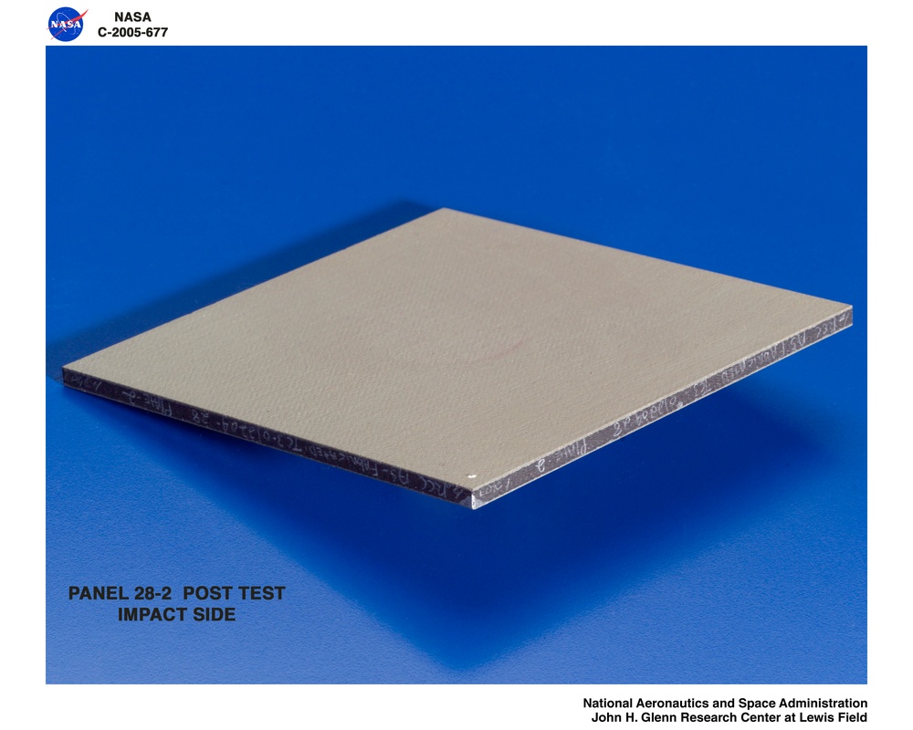 Panel 28-2 post test  RCC carbon / carbon fiber panels - the panels are space shuttle tile material being tested in the ballistics lab building 49