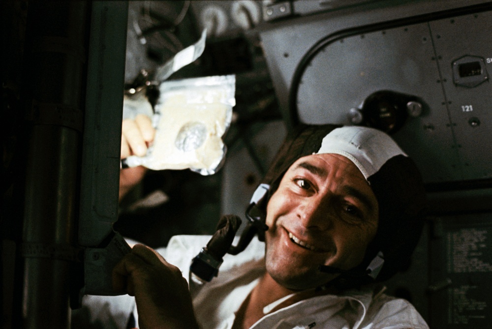 Apollo 17, Ronald Evans holds up a soup package