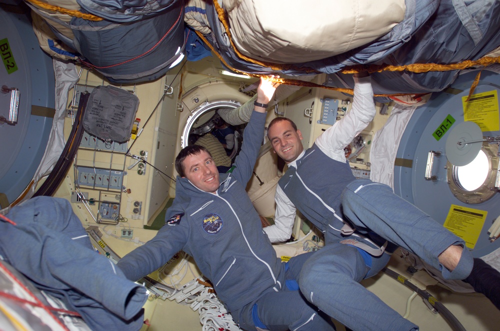 Soyuz 4 FE Vittori and SFP Shuttleworth pose in the FGB during Expedition Four