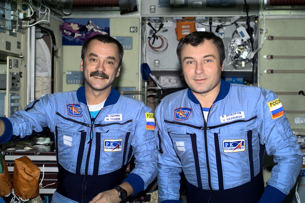 Dezhurov and Tyurin pose in Zvezda during Expedition Three