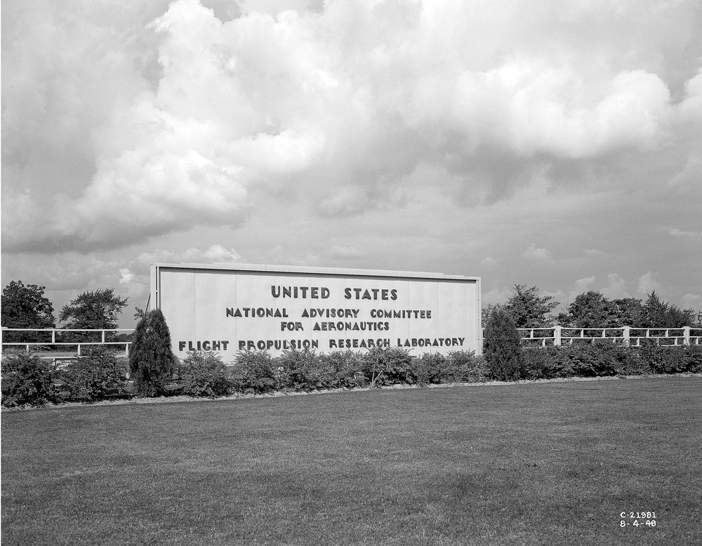 NACA SIGN AT FRONT GATE WITH FLIGHT PROPULSION RESEARCH LABORATORY FPRL ADDED