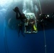 US Navy divers, alongside the Joint POW/MIA Accounting Command, search for an unaccounted-for service member who went missing during World War II