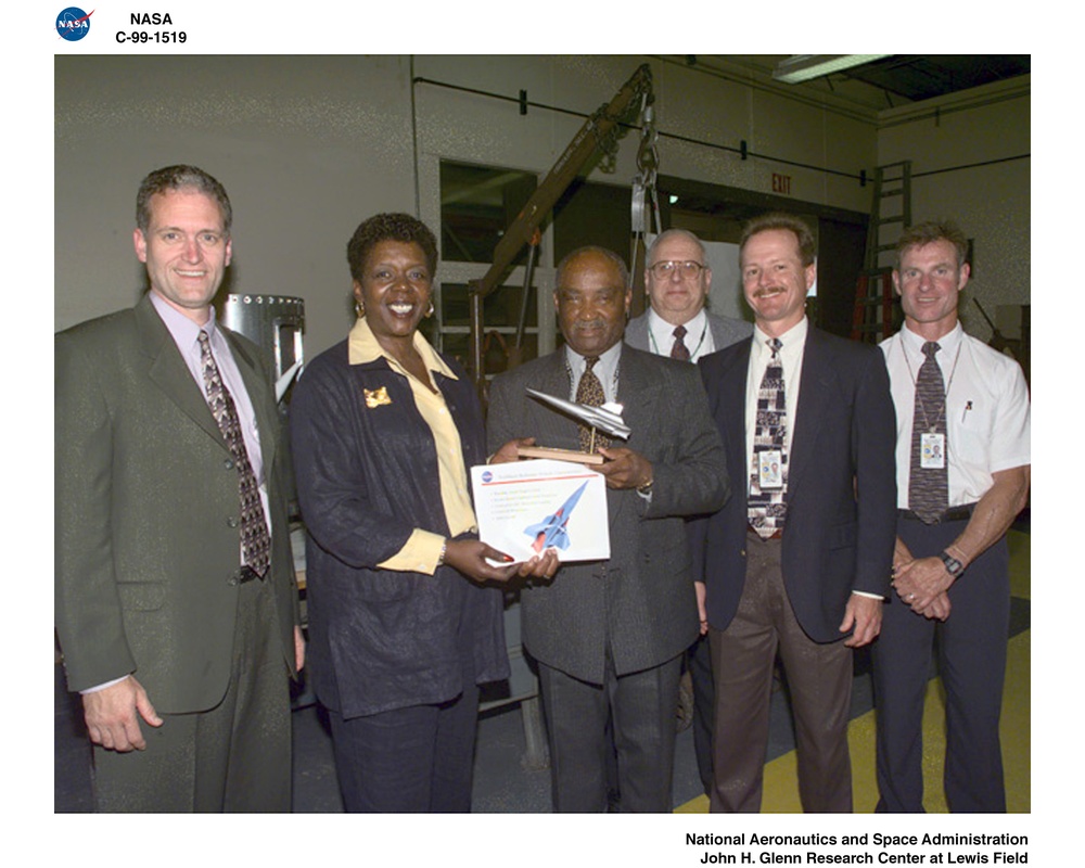 CONGRESSWOMAN STEPHANIE TUBBS JONES RECEIVING TRAILBLAZER MODEL AND OTHER  GLENN MEMORABILIA