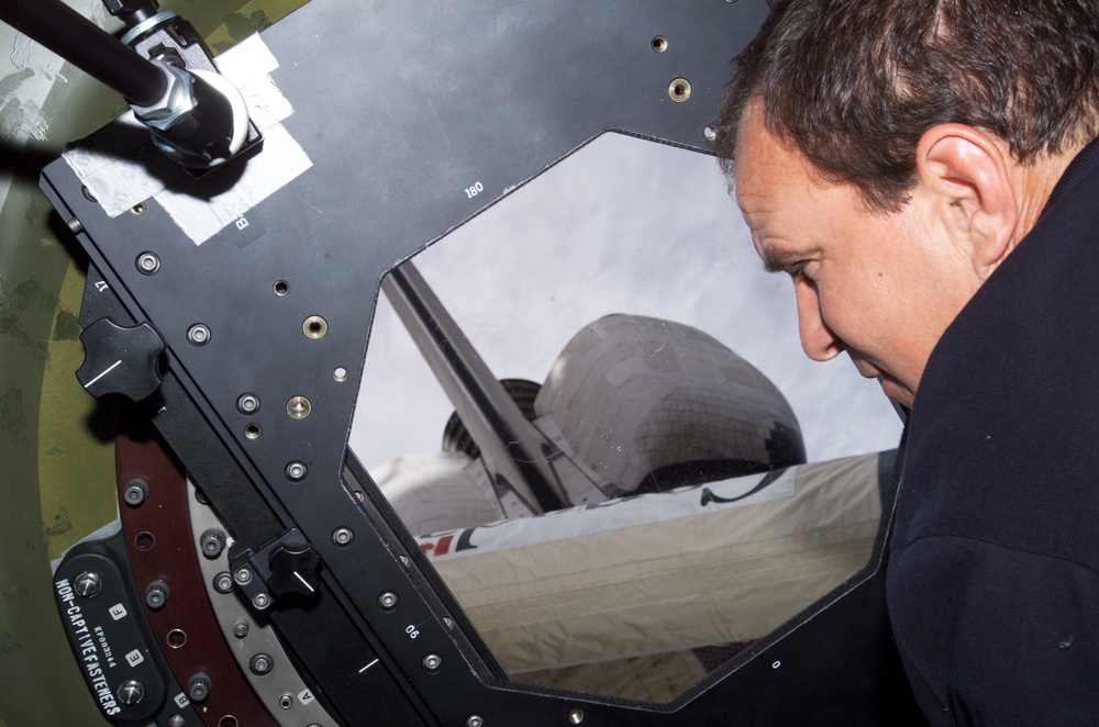 STS-110 CDR Bloomfield at nadir window in U.S. Lab during Expedition Four
