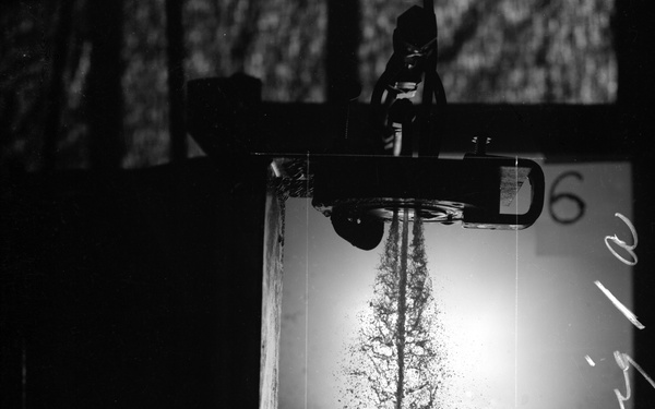 COMBUSTION AND PERFORMANCE STUDIES OF INJECTION PROCESSES IN A 200 POUND THRUST ROCKET ENGINE LIQUID OXYGEN LOX HEPTANE SYSTEM