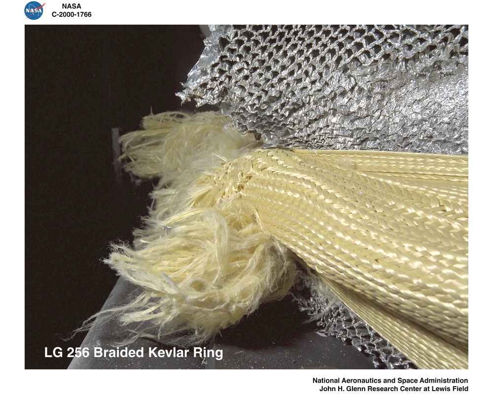 BALLISTIC IMPACT LABORATORY SPECIMENS OF BRAIDED KEVLAR RING AND BRAIDED NYLON RING AFTER IMPACT TESTING