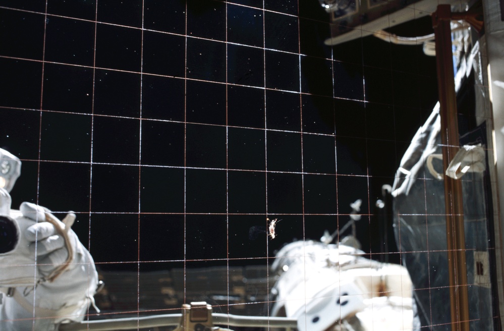 SM reflected off an EETCS radiator during Expedition Four EVA 3