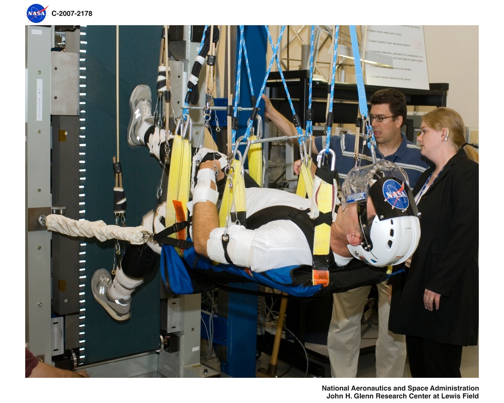 Astronaut &quot;running in space&quot; at the NASA Glenn Exercise Countermeasures Laboratory (eZLS) and the Vertical Treadmill (enhanced Zero-G Locomotion Simulator