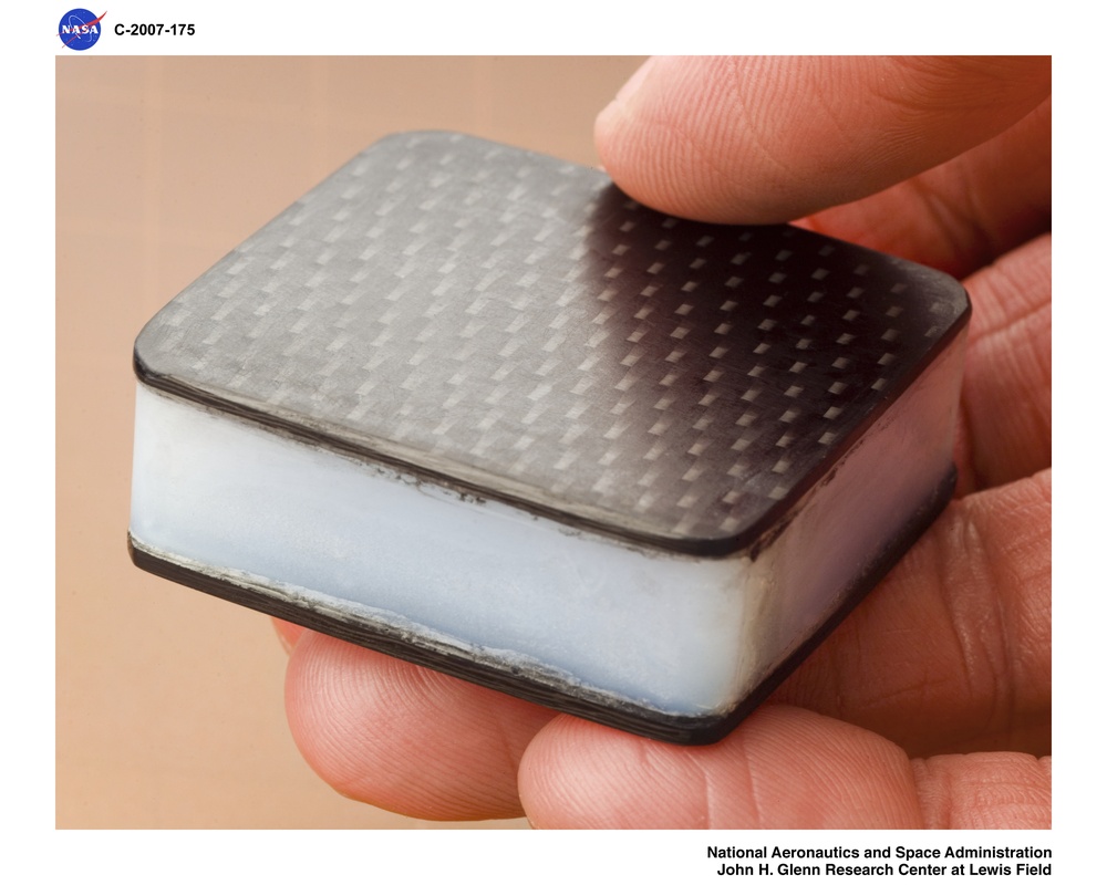 Monolithic aerogel slab sandwitched between 1mm thick PMR-15, Polymer Matrix Composite panels