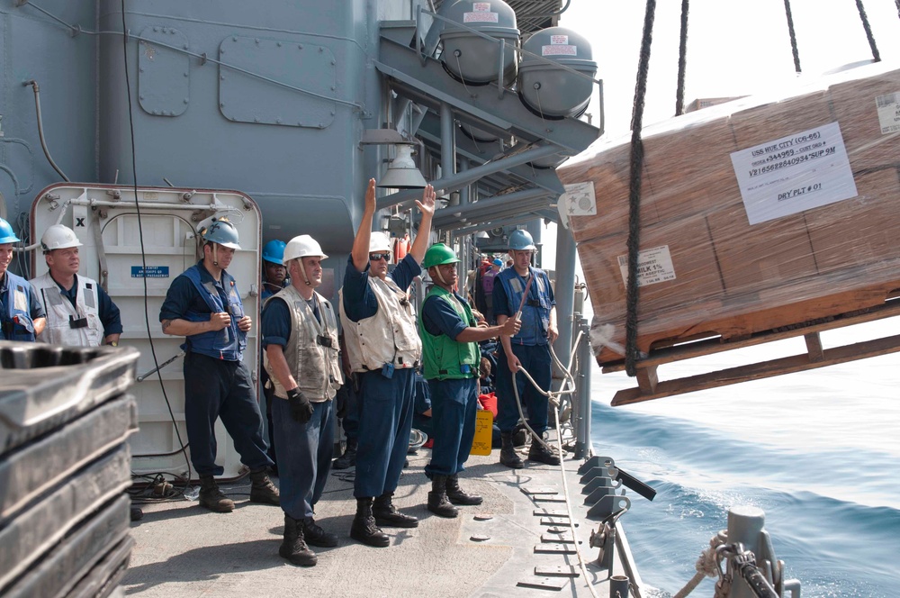 USS Hue City receives supplies at sea