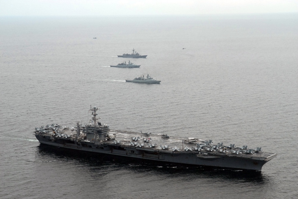 Washington, Vandegrift steam alongside Royal Malaysian Navy