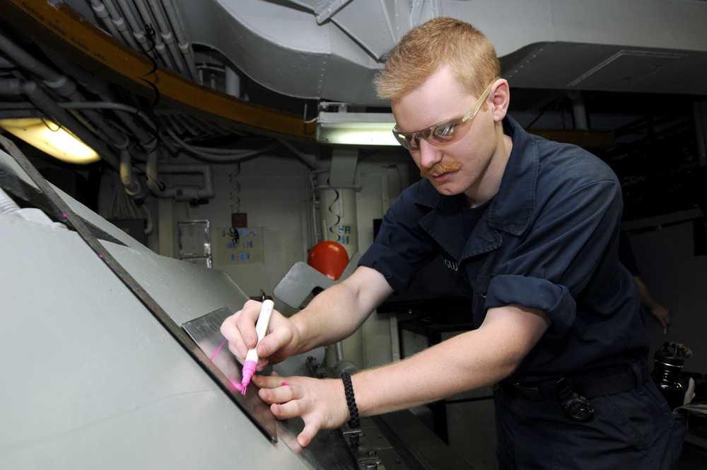 USS Nimitz crew performs maintenance