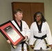 Public Affairs chief receives honorary black belt