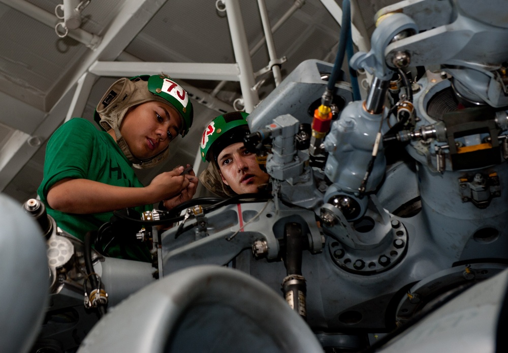 USS John C. Stennis crew maintains helicopters, drills