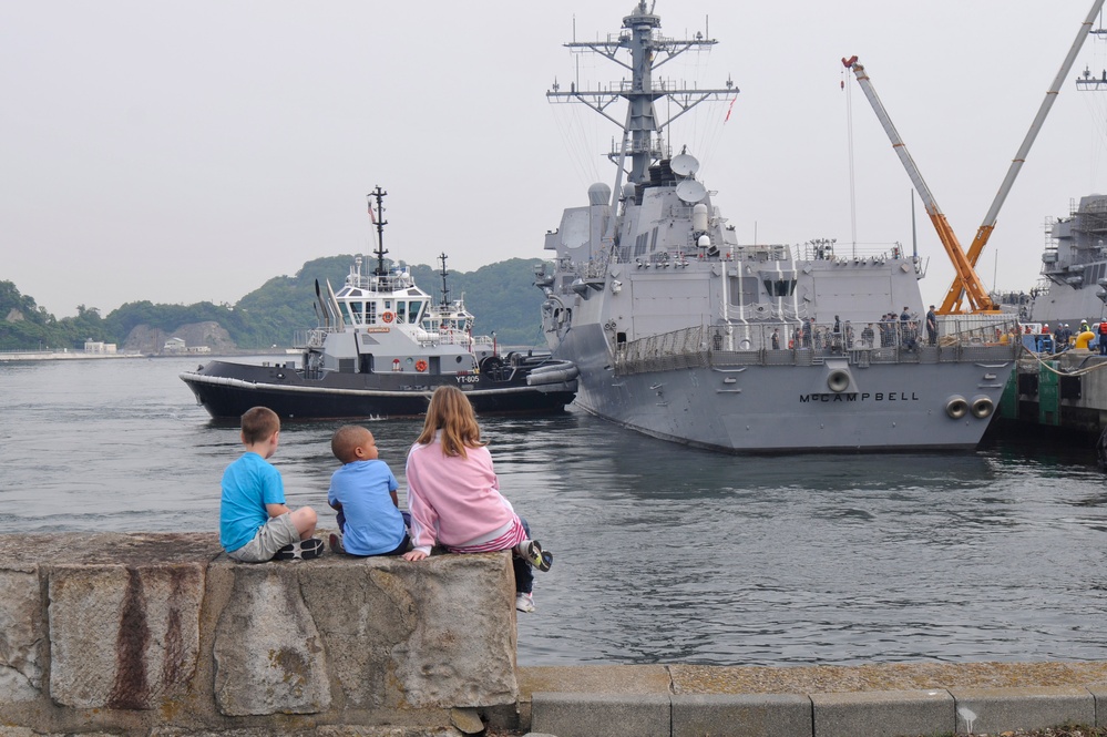 Children watch as USS McCampbell departs