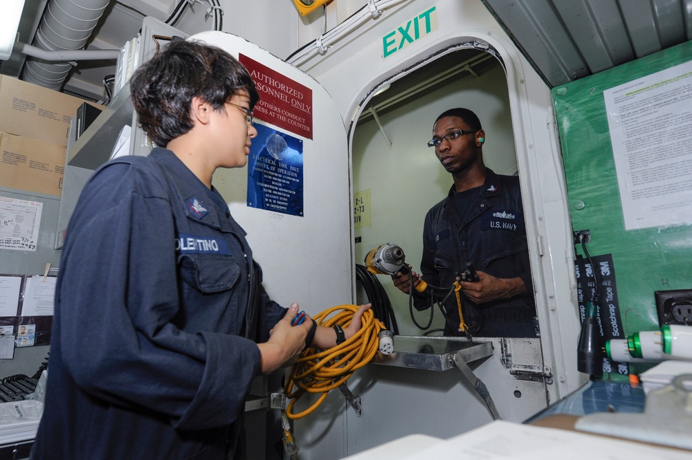 USS Bonhomme Richard crew checks tools