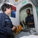 USS Bonhomme Richard crew checks tools