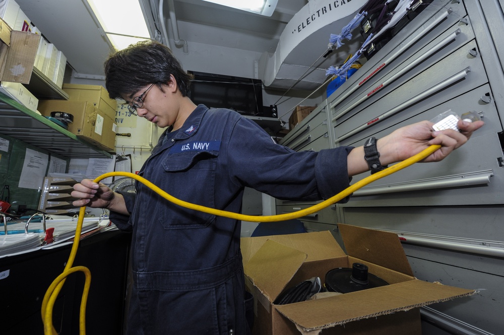 USS Bonhomme Richard crew checks tools