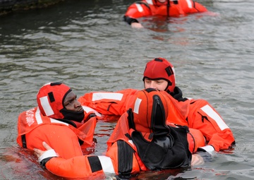 Coast Guard crew trains with cold water survival swims