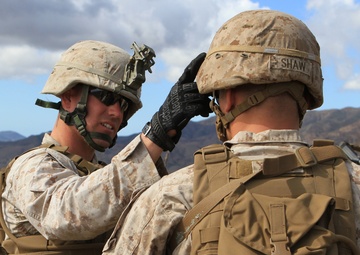 Small-unit leaders guide Marines through live-fire training