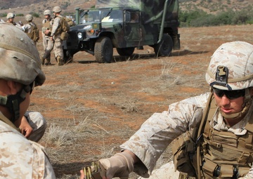 Small-unit leaders guide Marines through live-fire training