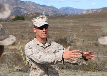 Small-unit leaders guide Marines through live-fire training