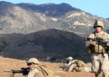 Small-unit leaders guide Marines through live-fire training