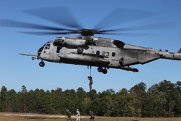Marines from 2nd Radio Battalion fast rope out of a CH-53E Super Stallion