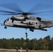 Marines from 2nd Radio Battalion fast rope out of a CH-53E Super Stallion