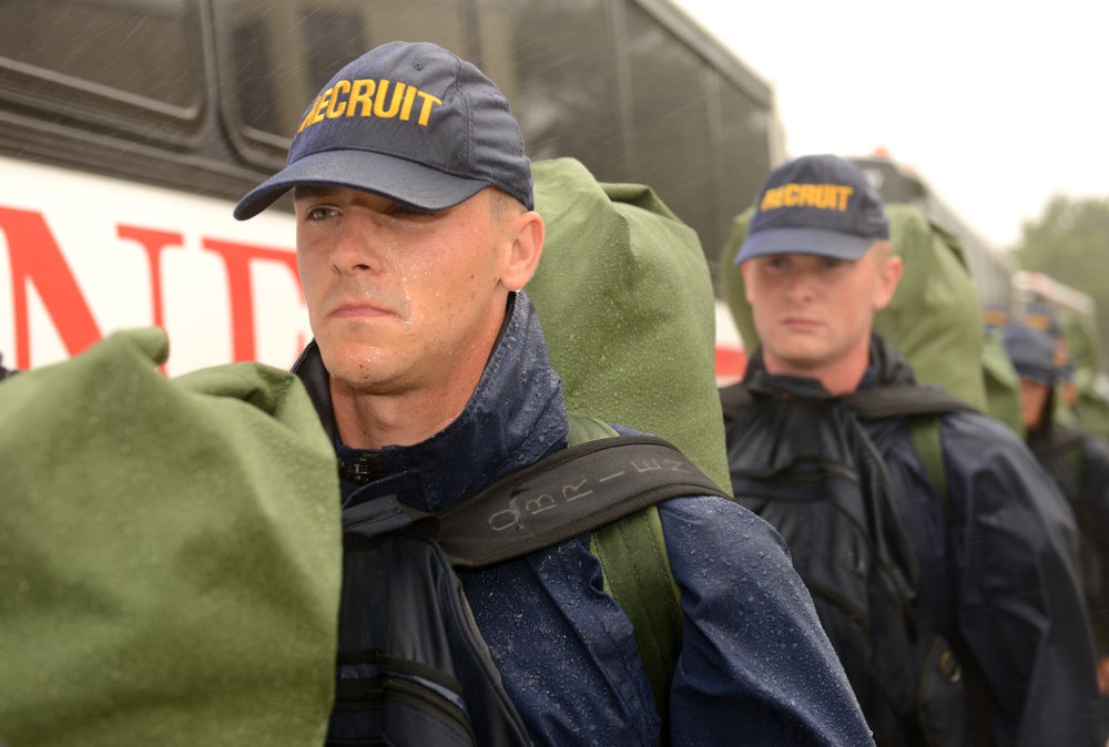 Coast Guard recruits prepare to board buses to evacuate Training Center Cape May